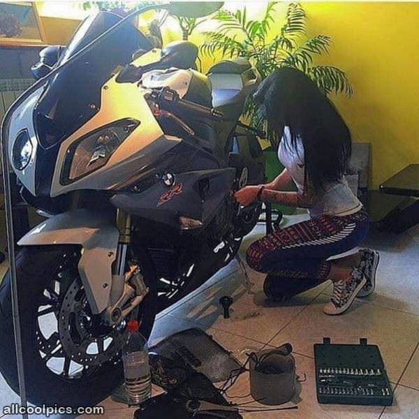 Working On Her Bike